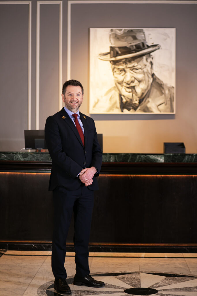 Head Concierge standing at The Hyatt Regency London The Churchill Hotel in Marylebone