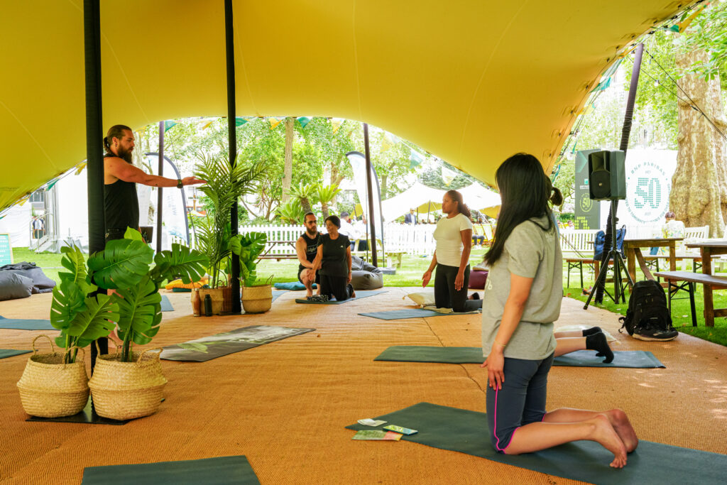 Yoga class at summer in the square, at Portman Square Garden in Marylebone