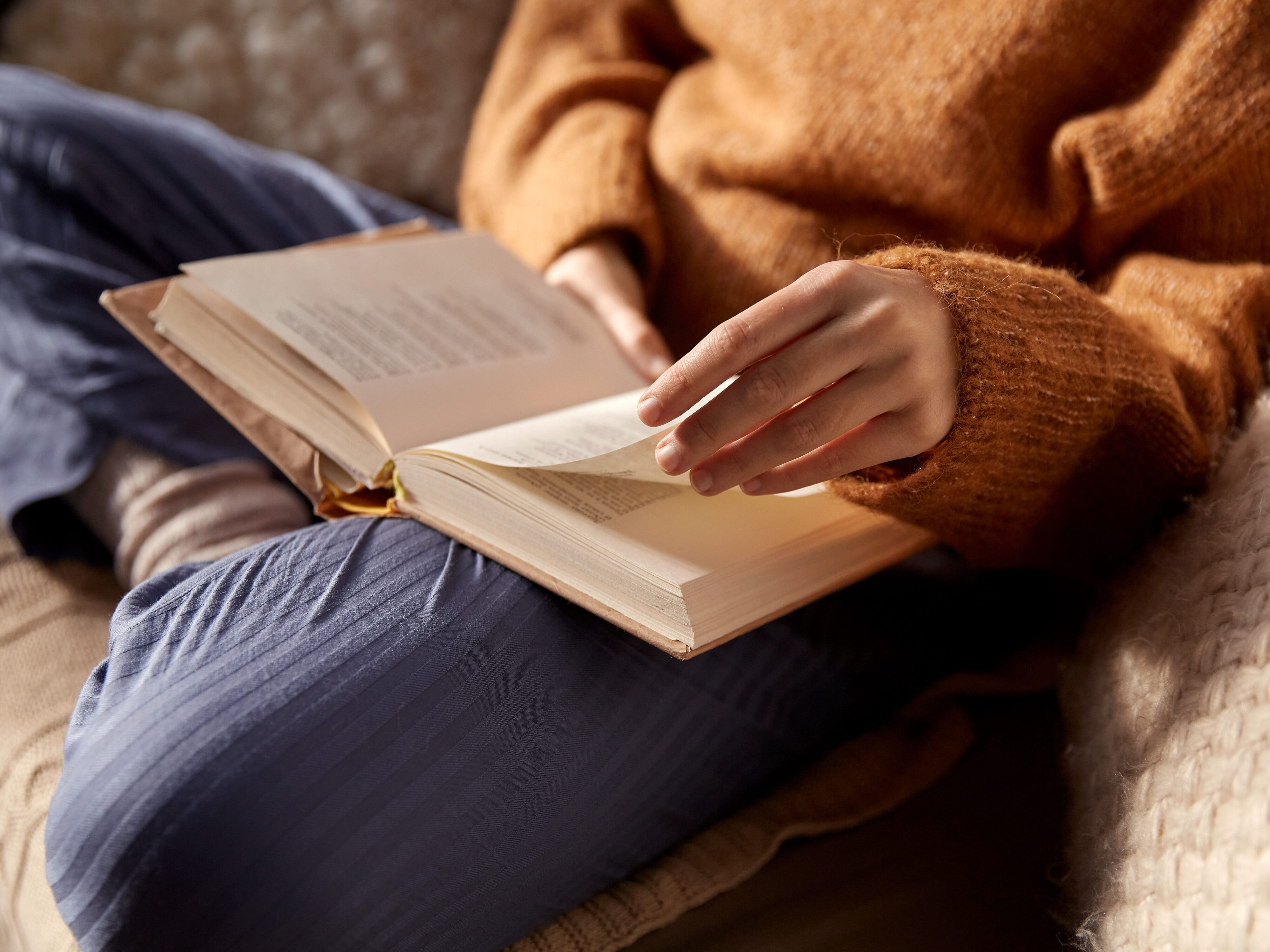 woman reading a book from Daunt Books library in Marylebone