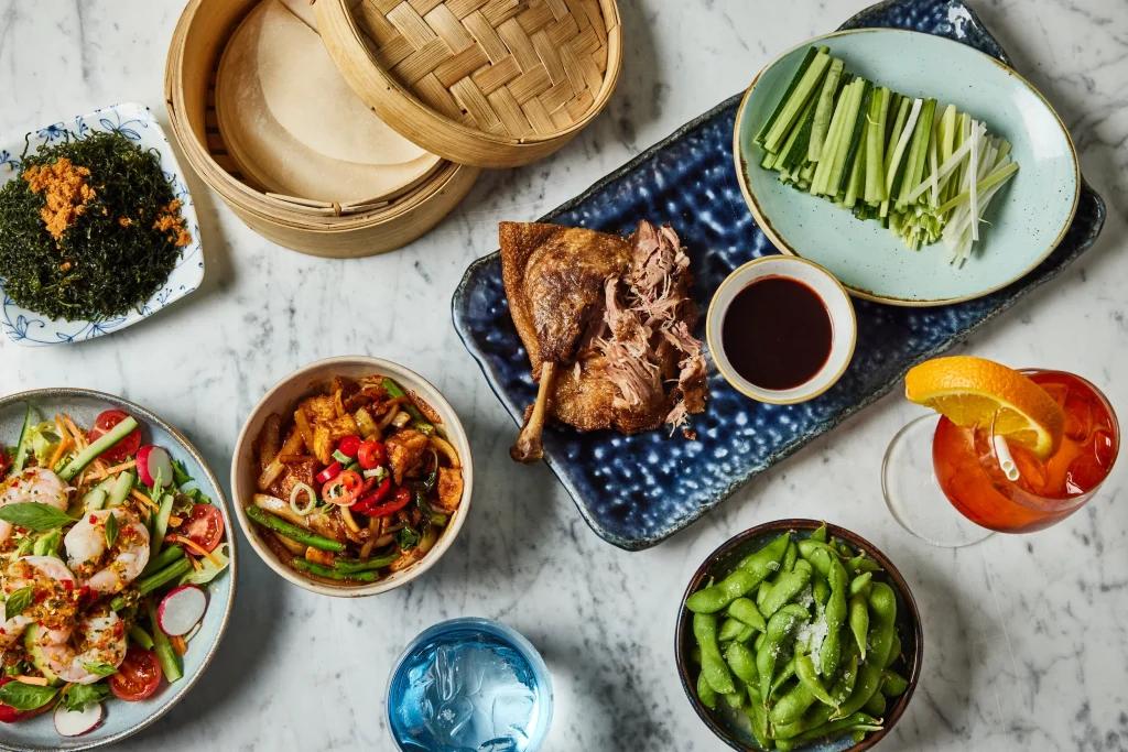 a table of food at uli restaurant in marylebone
