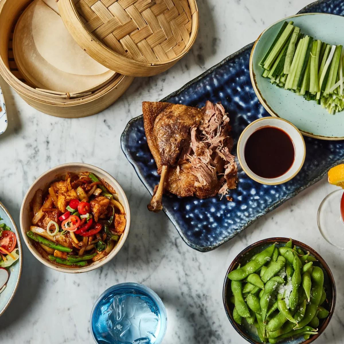 a table of food at uli restaurant in marylebone